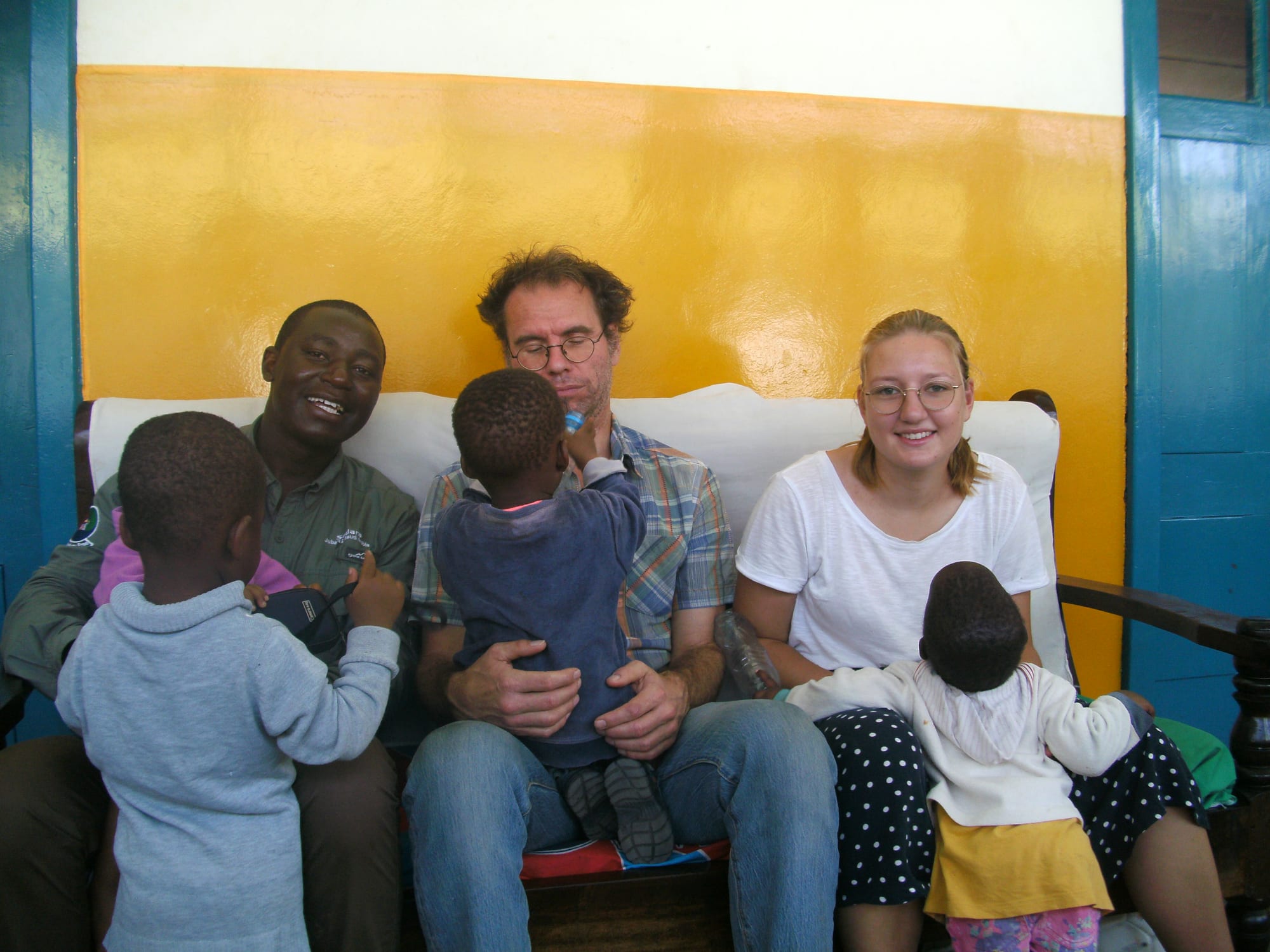 Adults and children seated together